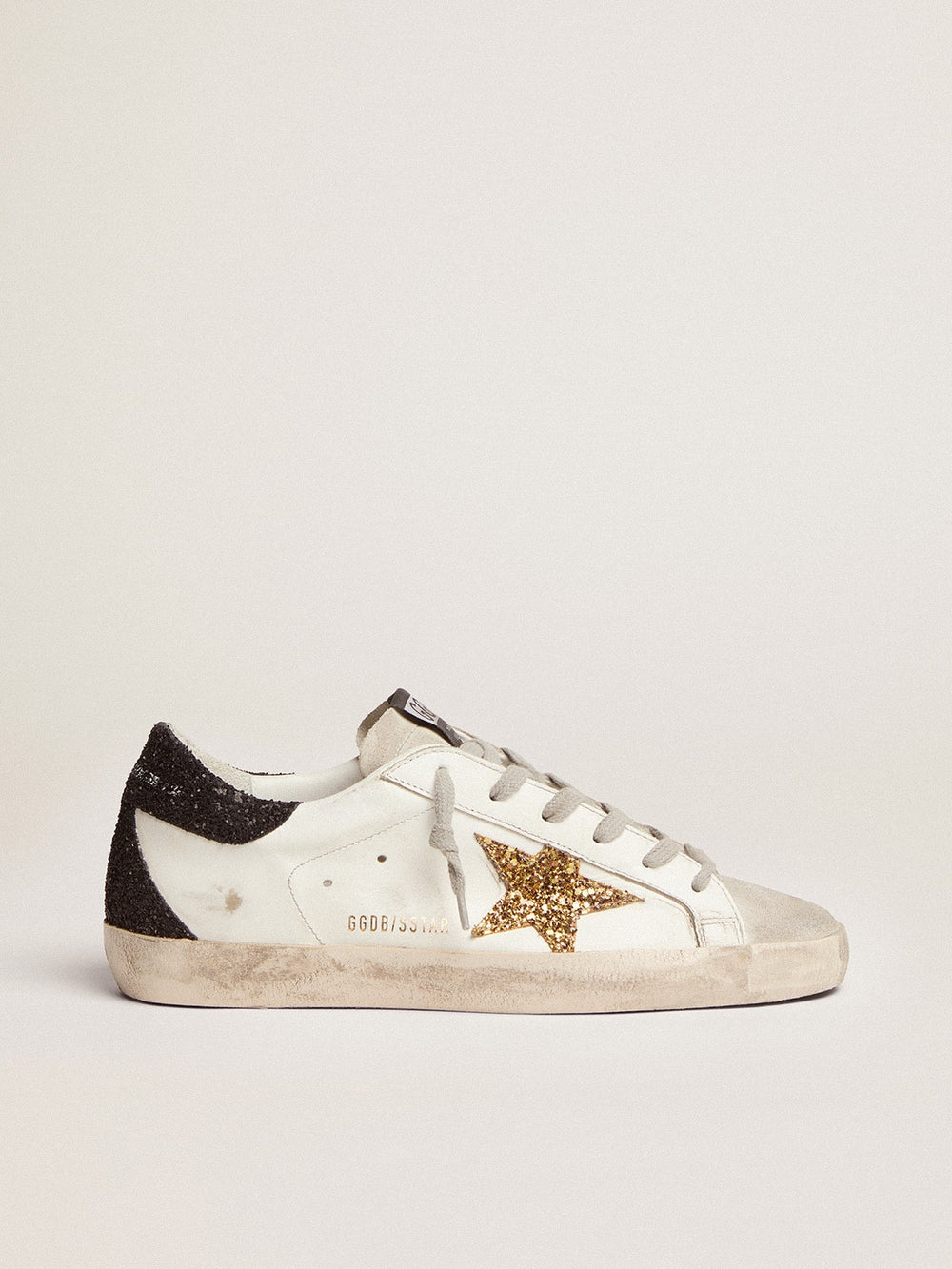 Golden Goose Women’s Super-Star in nappa leather with gold glitter star and black glitter heel tab