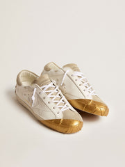 Golden Goose Women's Super-Star LTD in white leather with ice-gray suede inserts and gold-colored tape
