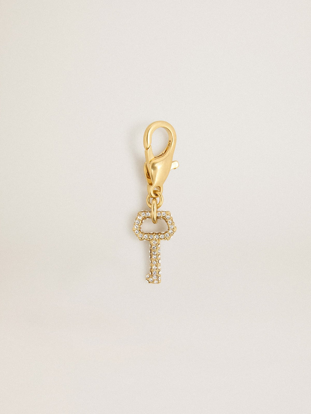 Golden Goose Key-shaped charm in gold-colored brass with crystals
