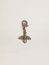 Golden Goose Bee-shaped charm in silver-colored brass with crystals