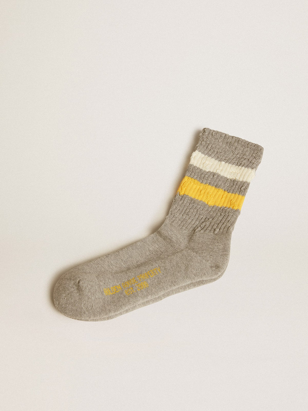 Golden Goose Gray socks with distressed details and yellow and white stripes