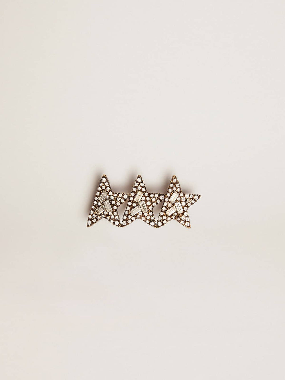 Golden Goose Lace accessory with three antique gold color stars with crystals