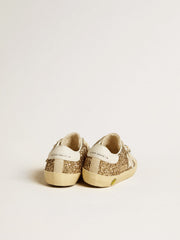 Golden Goose Super-Star Junior in gold glitter with white leather star and heel tab