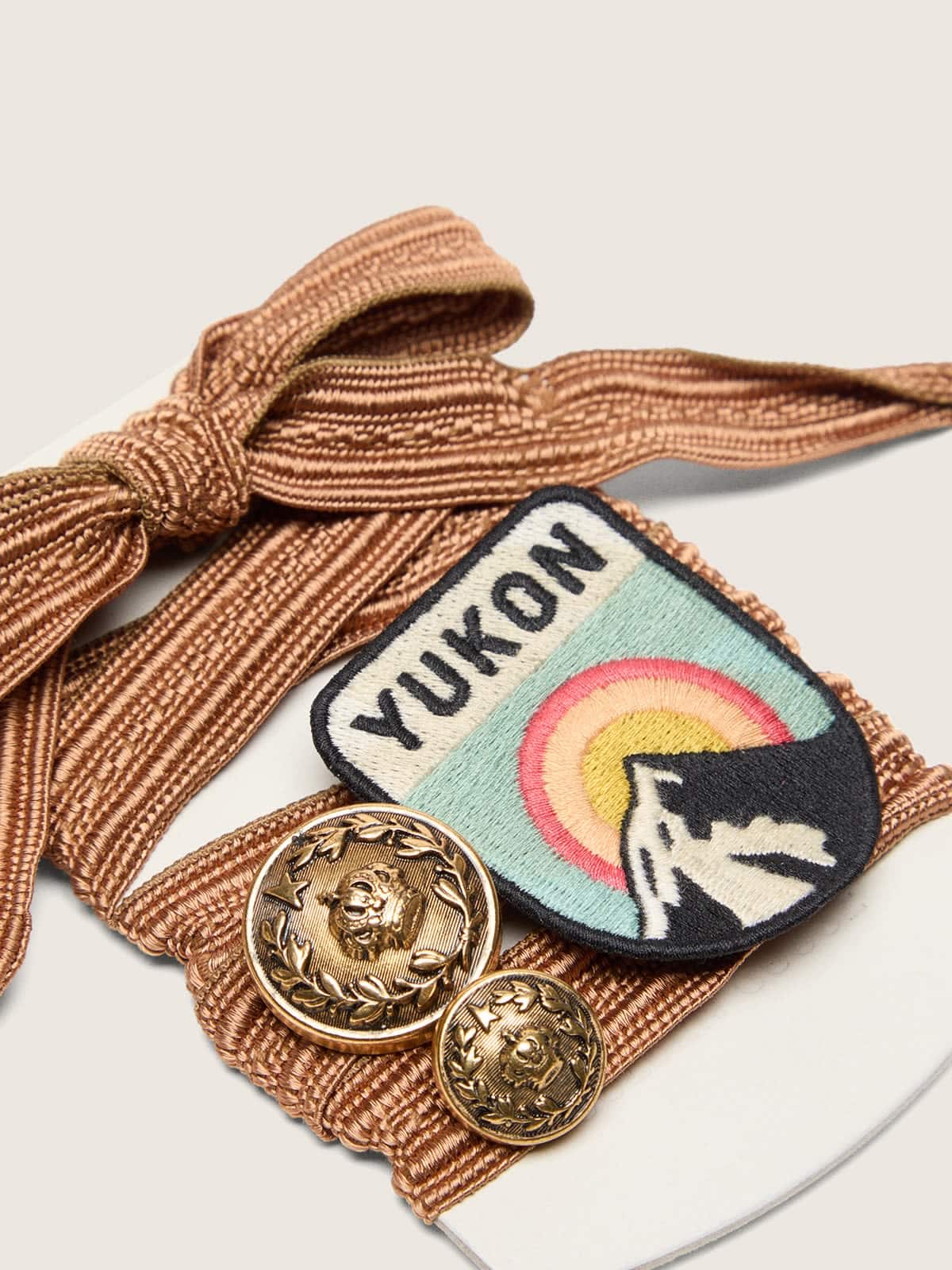 Golden Goose Skins burgundy and peach embroidered laces with patch and two charms