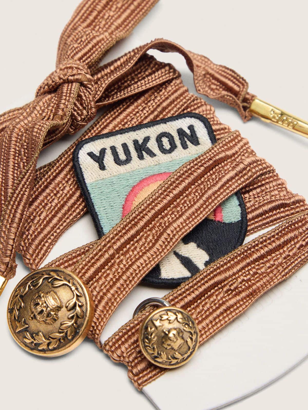 Golden Goose Skins burgundy and peach embroidered laces with patch and two charms