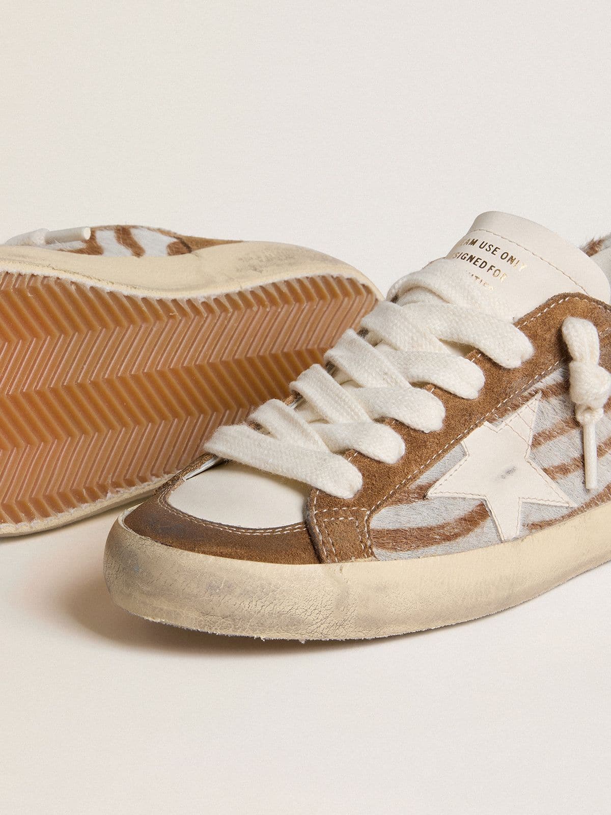 Golden Goose Women's Super-Star in zebra-print pony skin with leather star and brown suede inserts