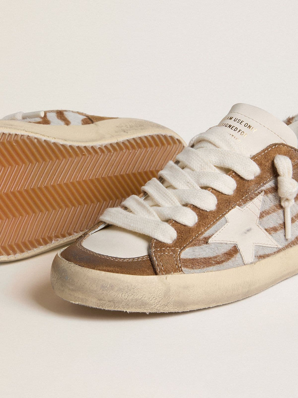 Golden Goose Women's Super-Star in zebra-print pony skin with leather star and brown suede inserts