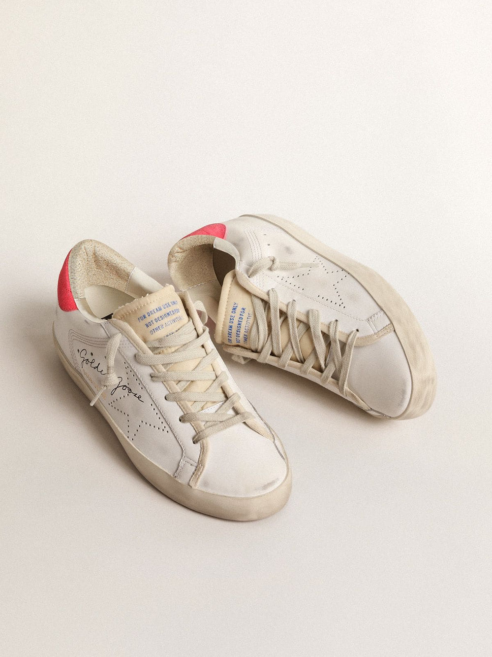 Golden Goose Women's white leather Super-Star with perforated star and fuchsia nylon heel tab