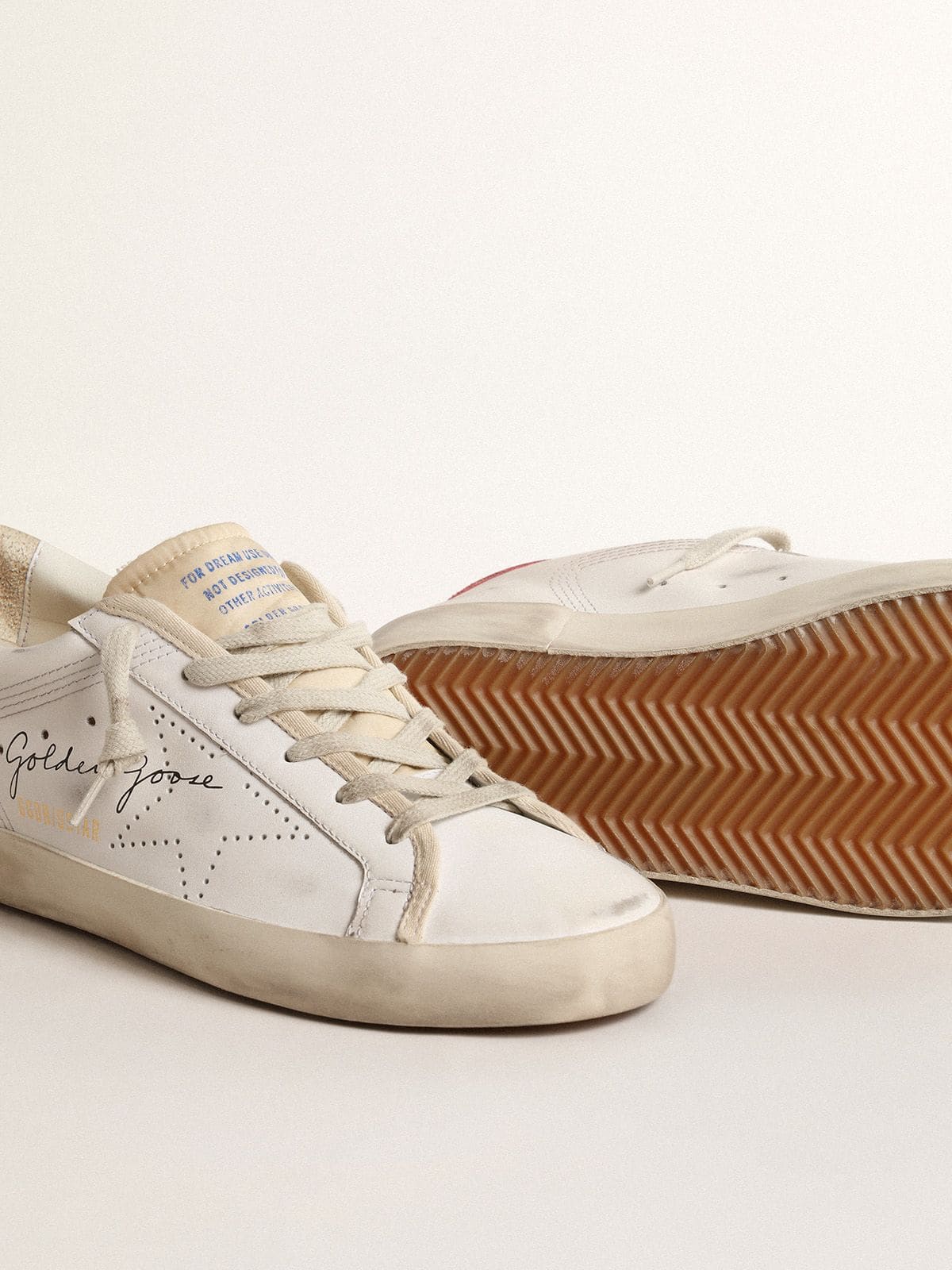 Golden Goose Women's white leather Super-Star with perforated star and fuchsia nylon heel tab
