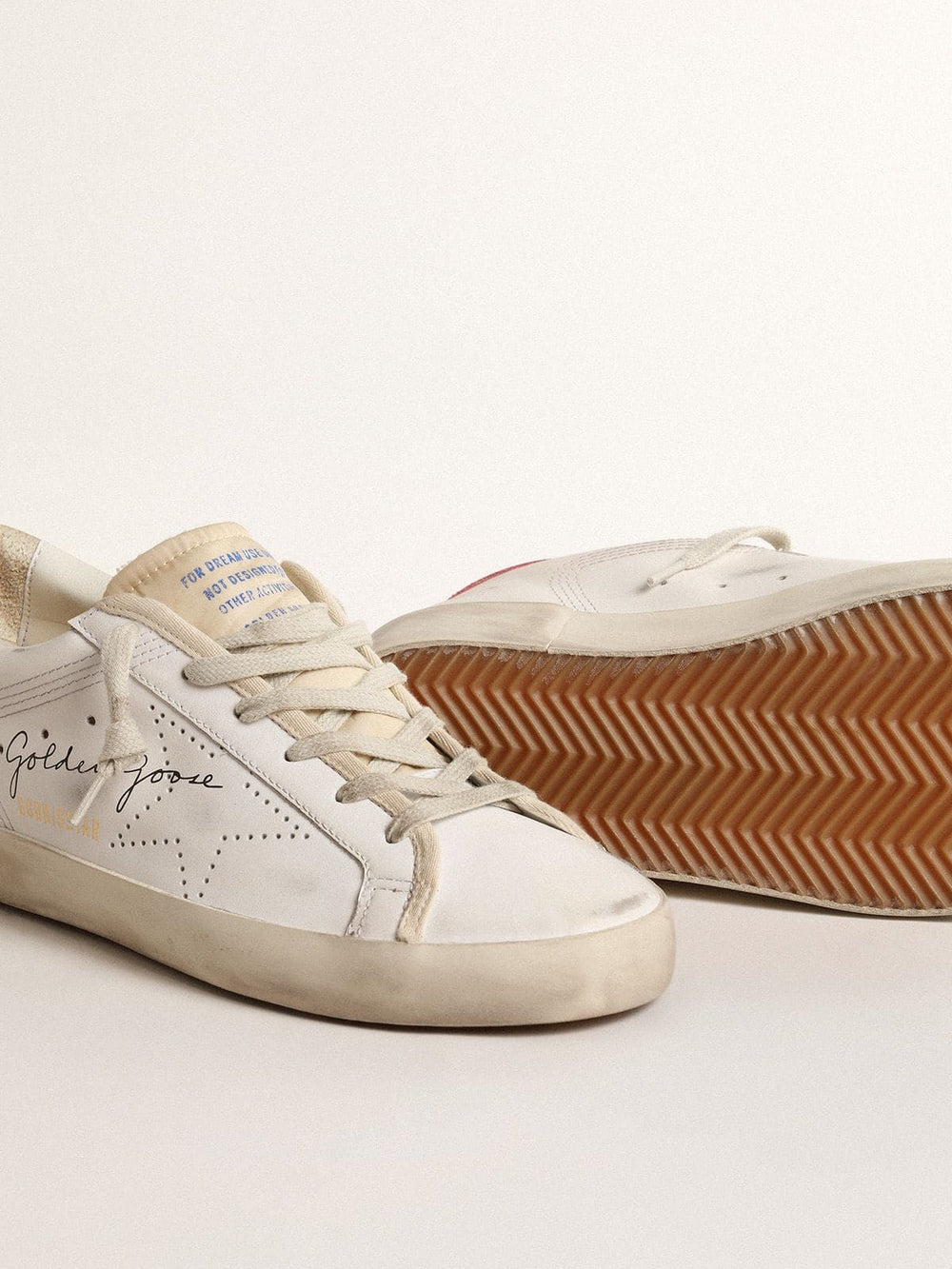 Golden Goose Women's white leather Super-Star with perforated star and fuchsia nylon heel tab