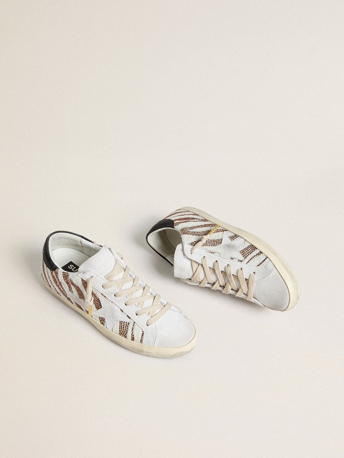 Golden Goose Women’s Super-Star LTD in white pony skin with brown glitter and white suede star