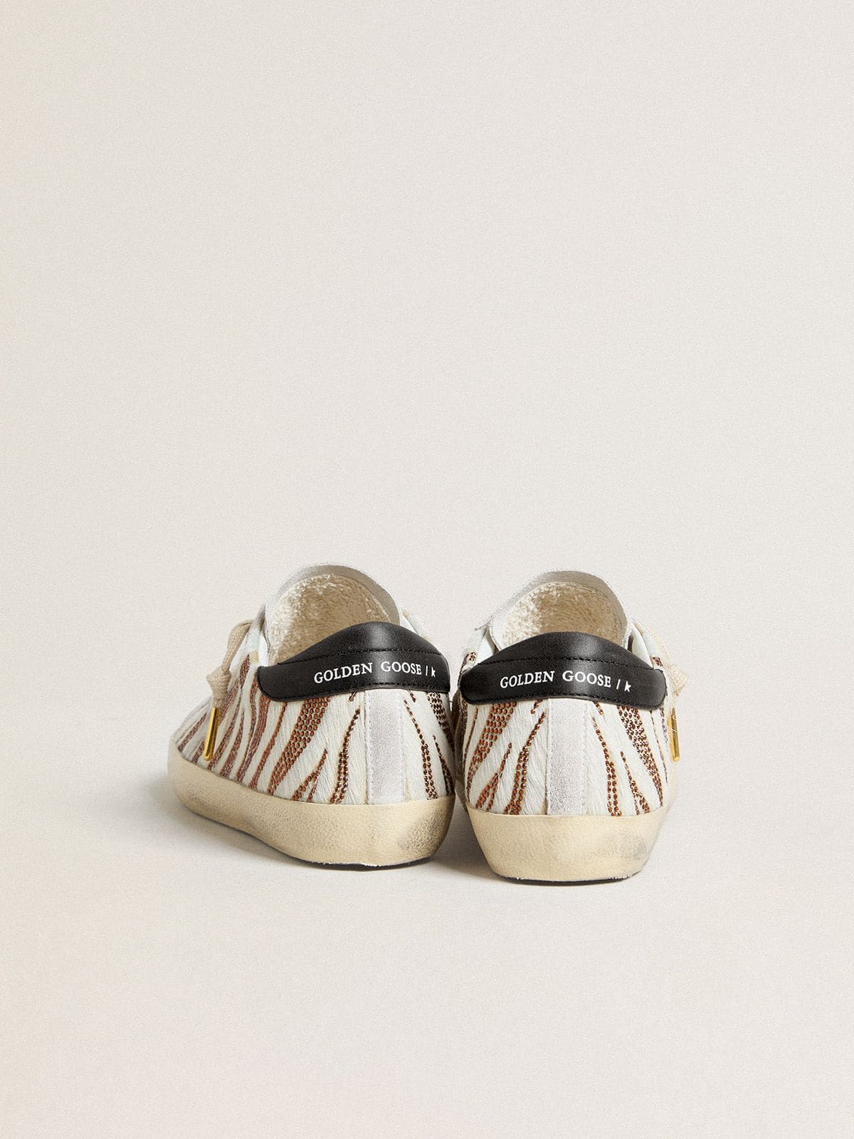 Golden Goose Women’s Super-Star LTD in white pony skin with brown glitter and white suede star
