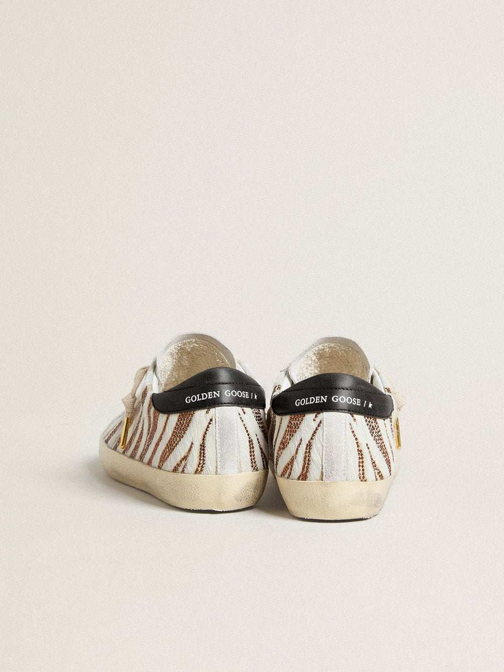 Golden Goose Women’s Super-Star LTD in white pony skin with brown glitter and white suede star
