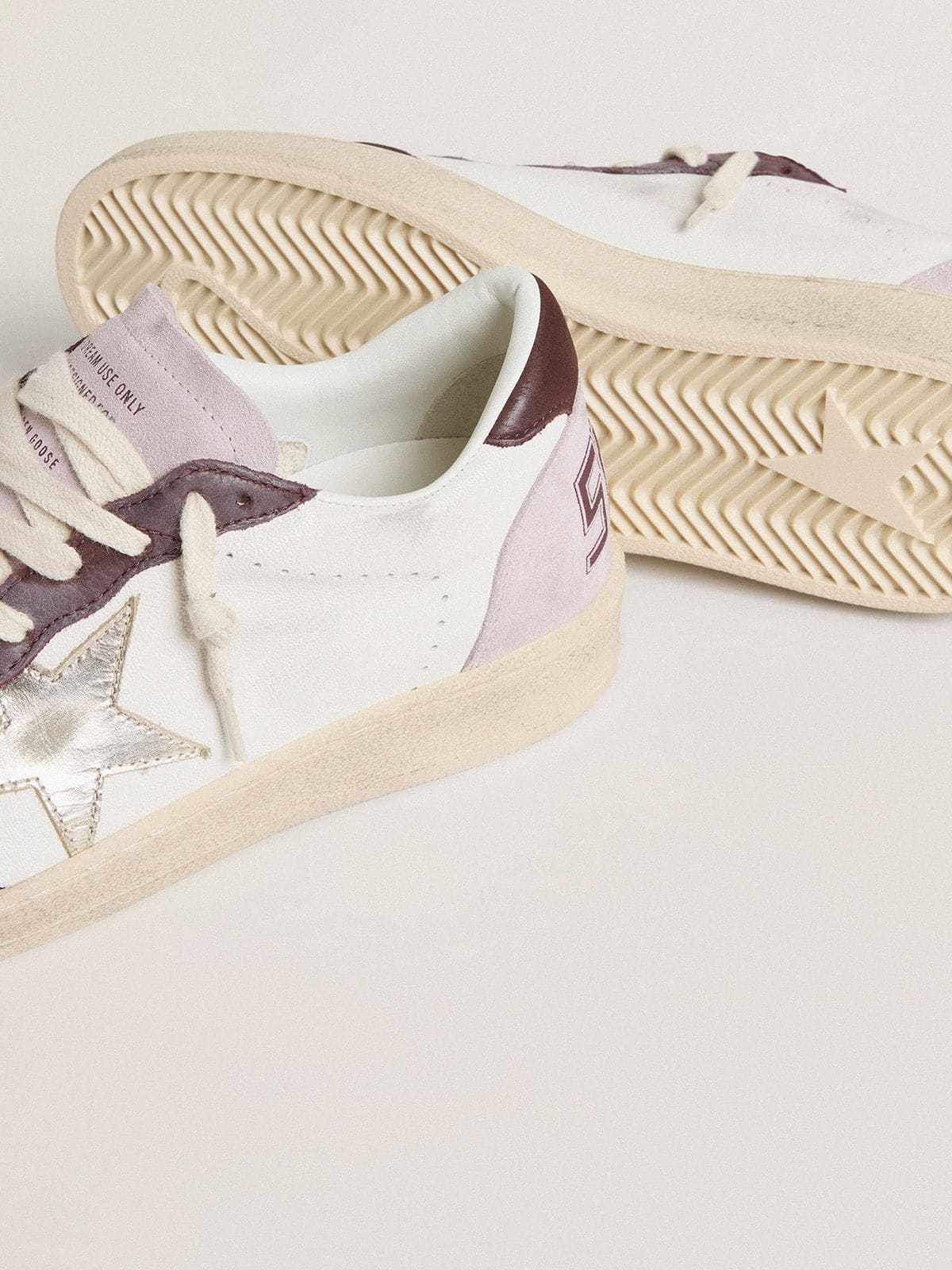Golden Goose Women's Ball Star LTD in nappa with platinum foiled leather star and burgundy nubuck leather heel tab