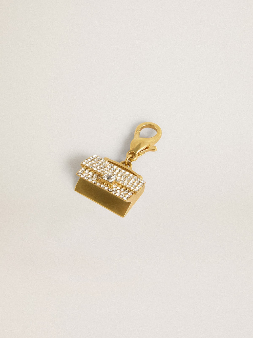 Golden Goose Purse-shaped charm in gold-colored brass with crystals