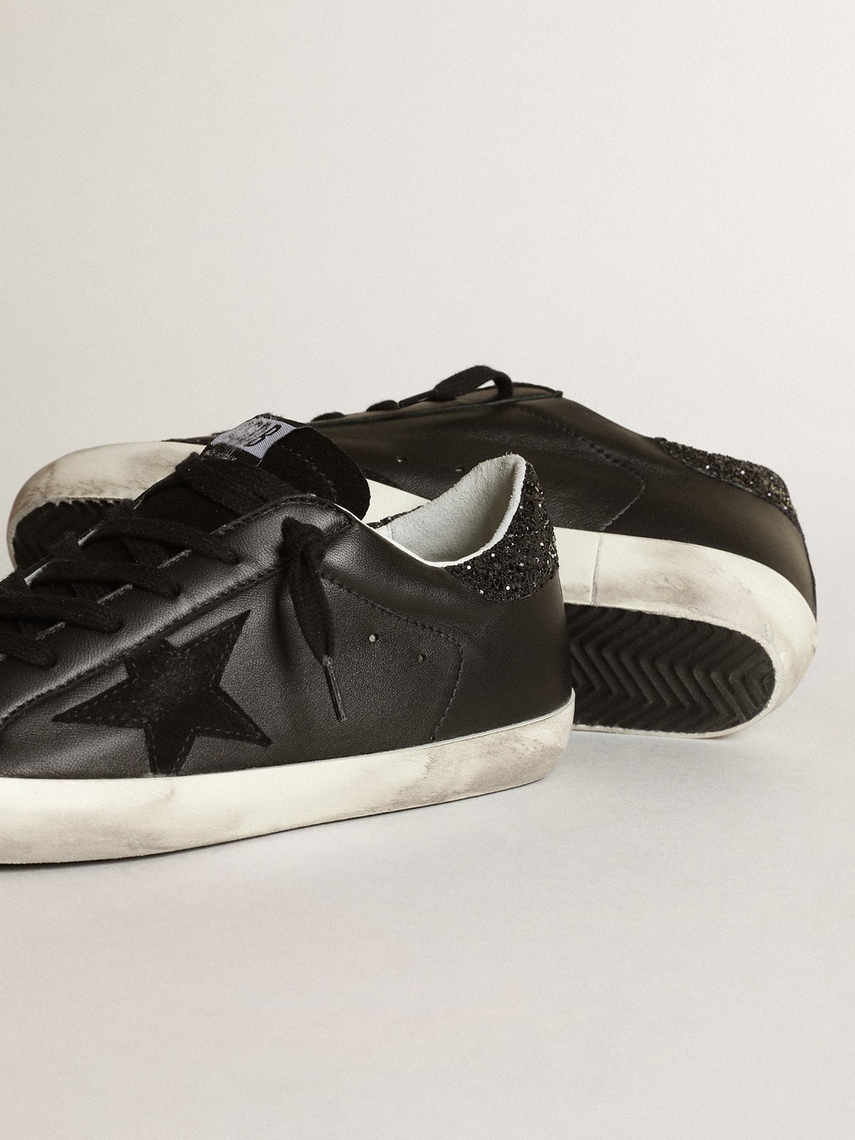 Golden Goose Women's Super-Star in black nappa with black star and glitter heel tab
