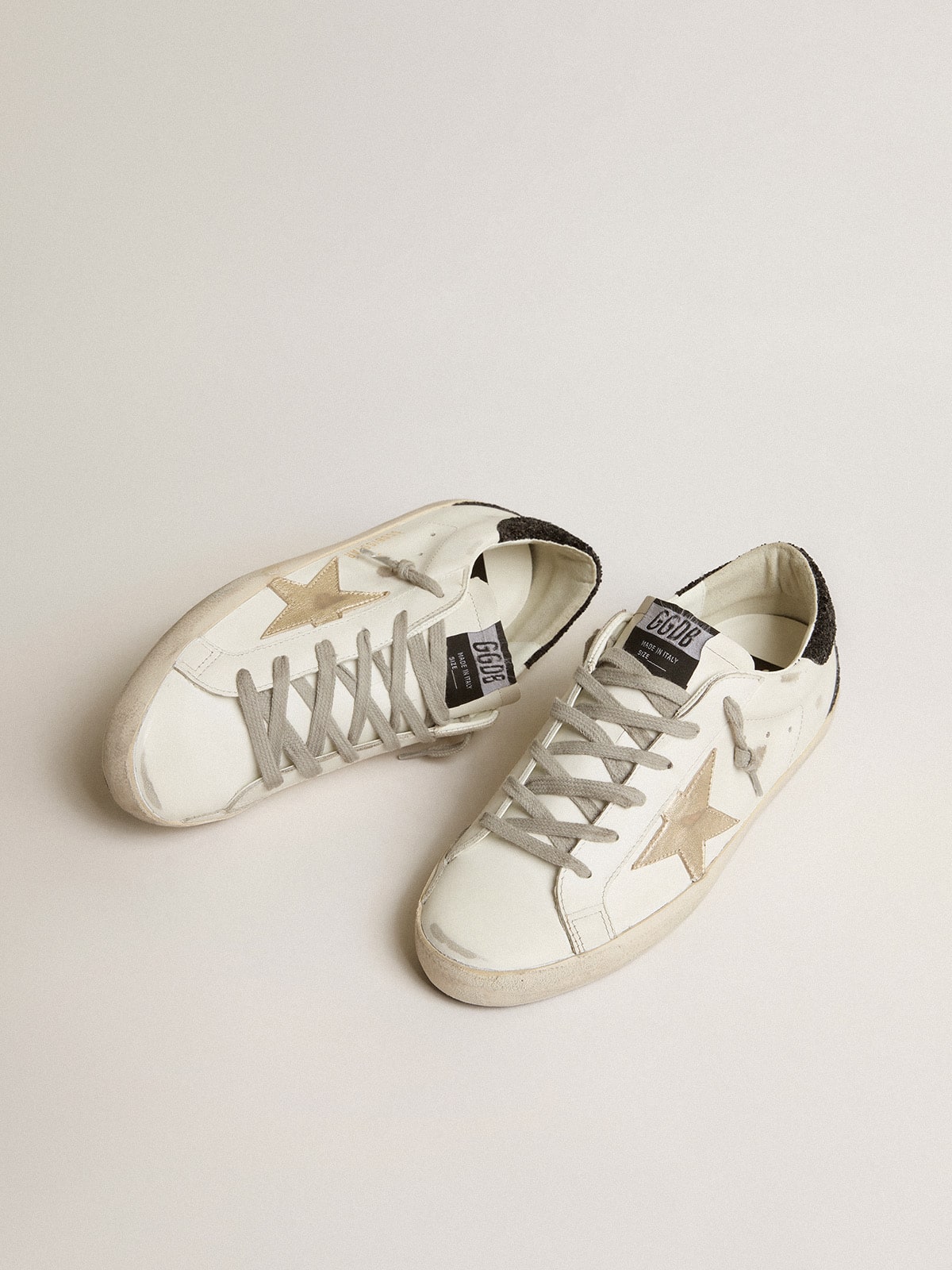 Golden Goose Women's Super-Star with gold star and black glitter heel tab