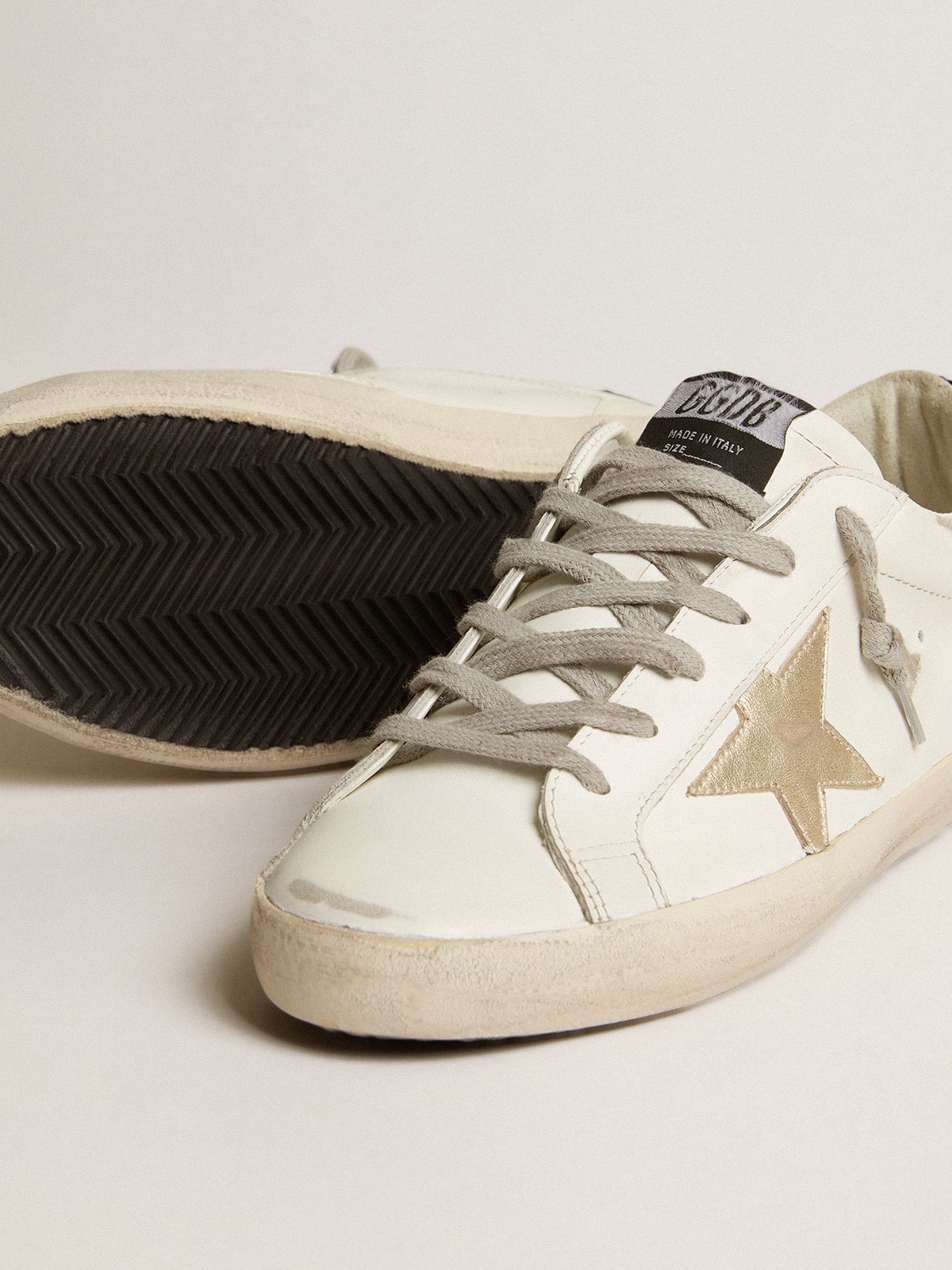 Golden Goose Women's Super-Star with gold star and black glitter heel tab