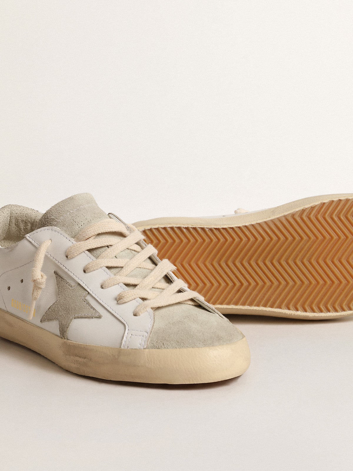 Golden Goose Women's Super-Star with gray star and silver glitter heel tab