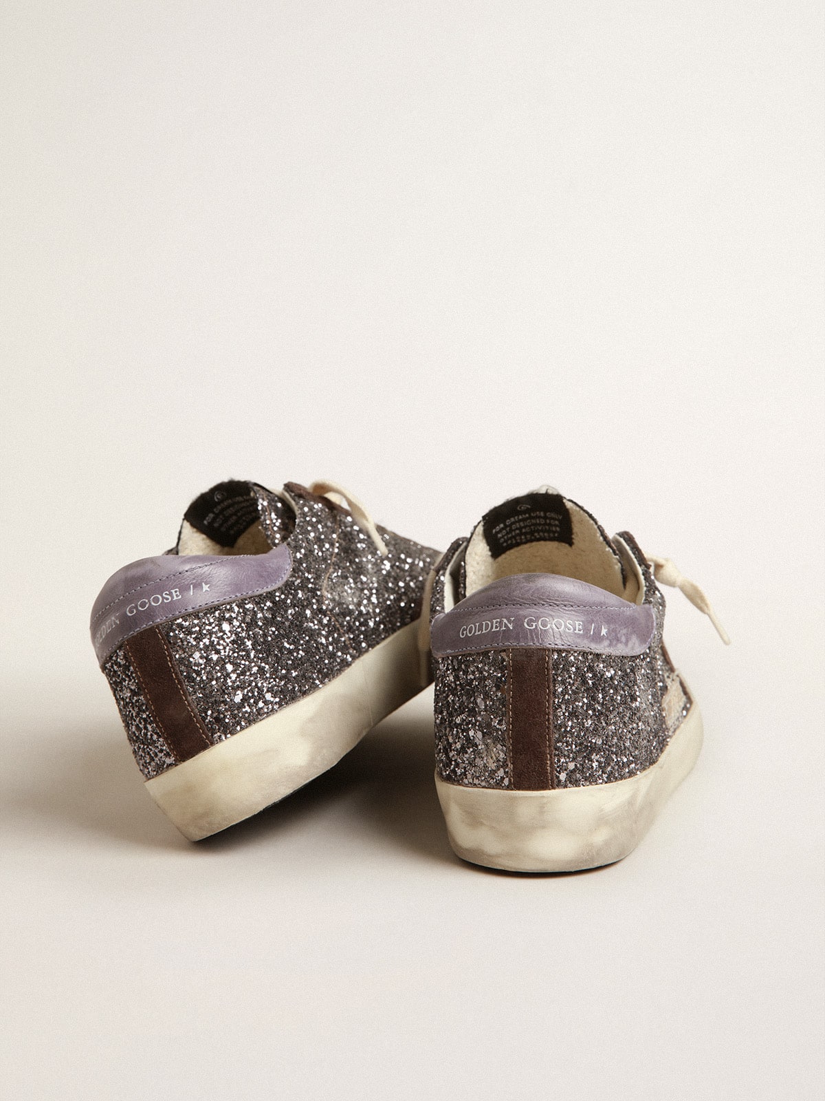 Golden Goose Super-Star in glitter with a brown star and lilac heel tab