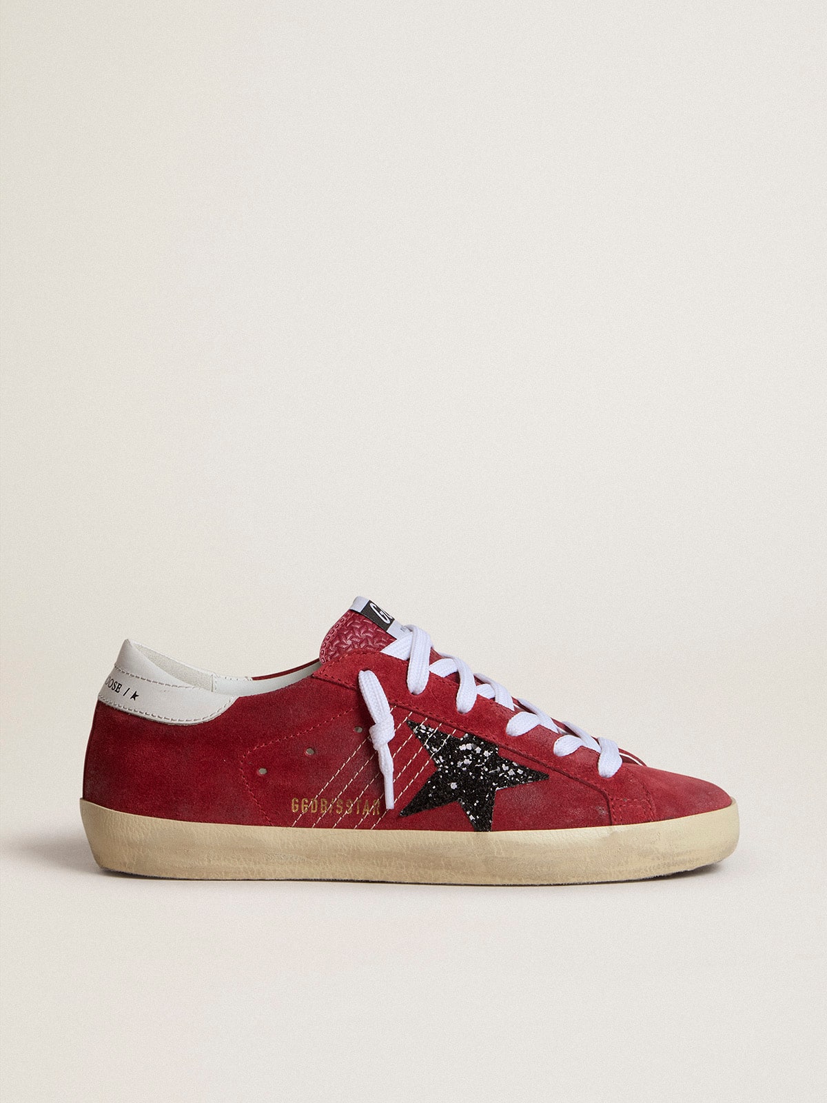 Golden Goose Women’s Super-Star in red suede with glitter star and white heel tab