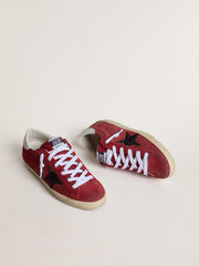 Golden Goose Women’s Super-Star in red suede with glitter star and white heel tab