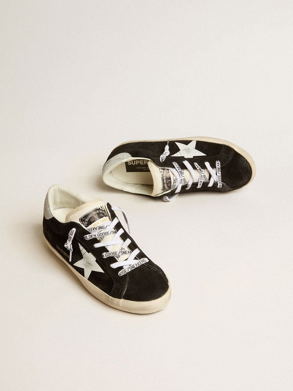 Golden Goose Women's Super-Star LTD in black suede with white printed star and silver glitter heel tab