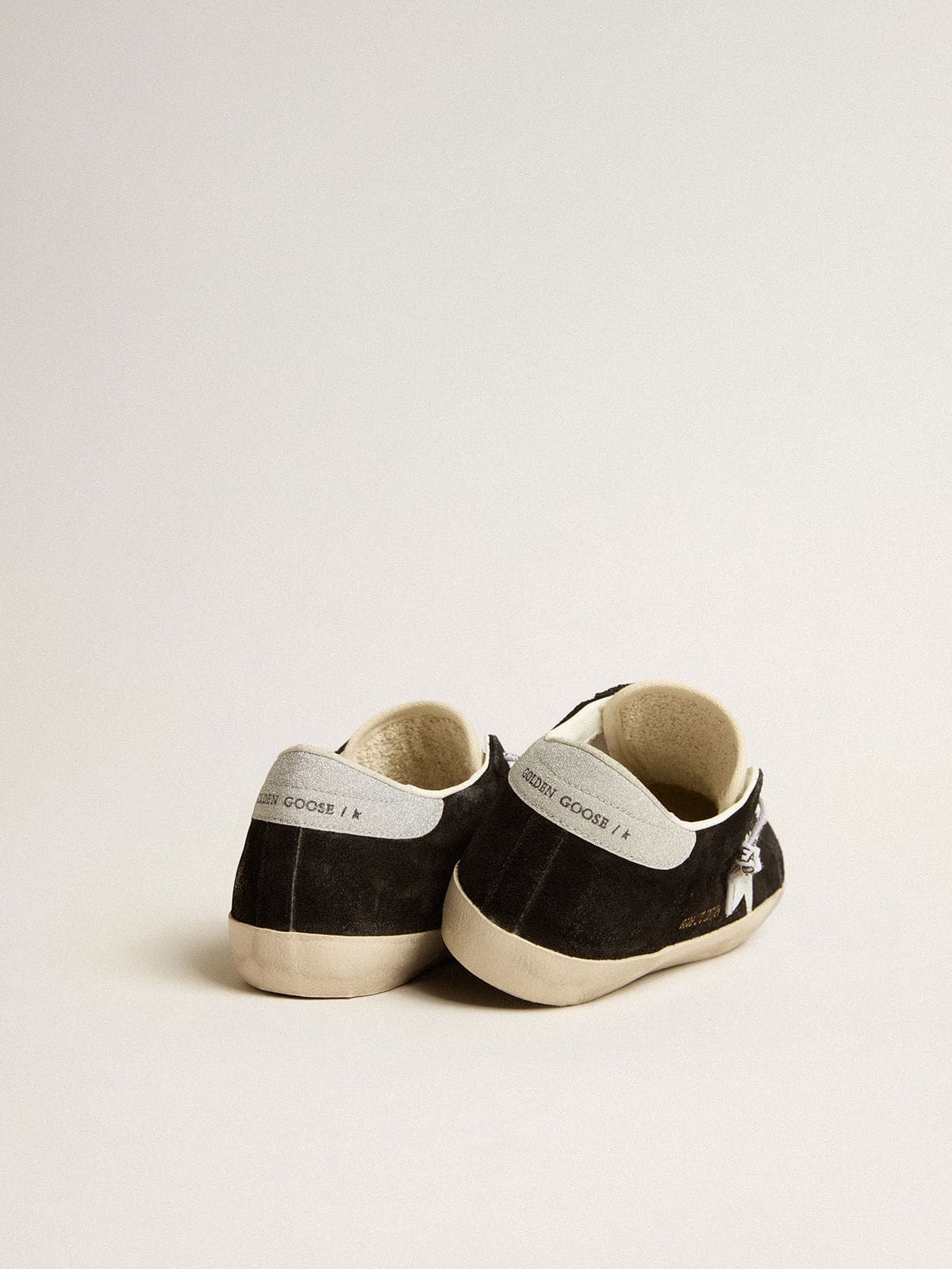 Golden Goose Women's Super-Star LTD in black suede with white printed star and silver glitter heel tab