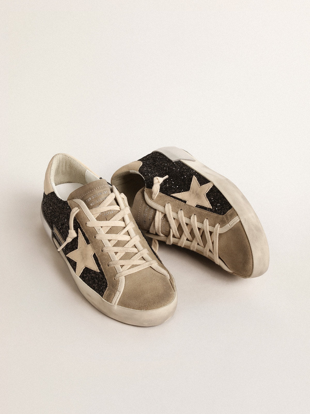 Golden Goose Super-Star in black glitter with cream star and suede inserts