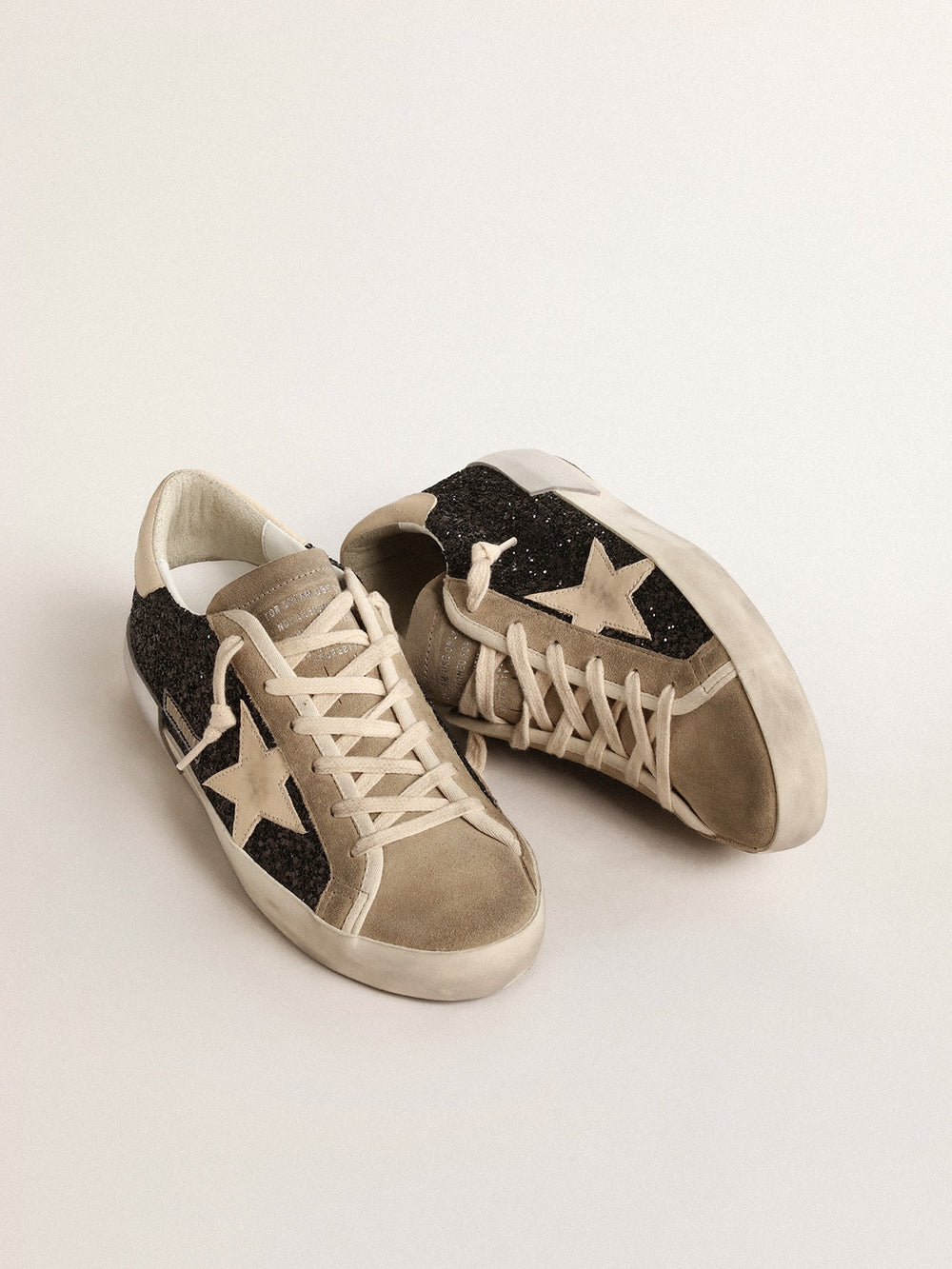 Golden Goose Super-Star in black glitter with cream star and suede inserts