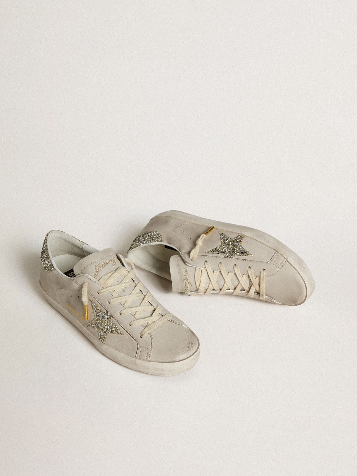 Golden Goose Women's Super-Star  in ivory nappa leather with platinum glitter star and heel tab