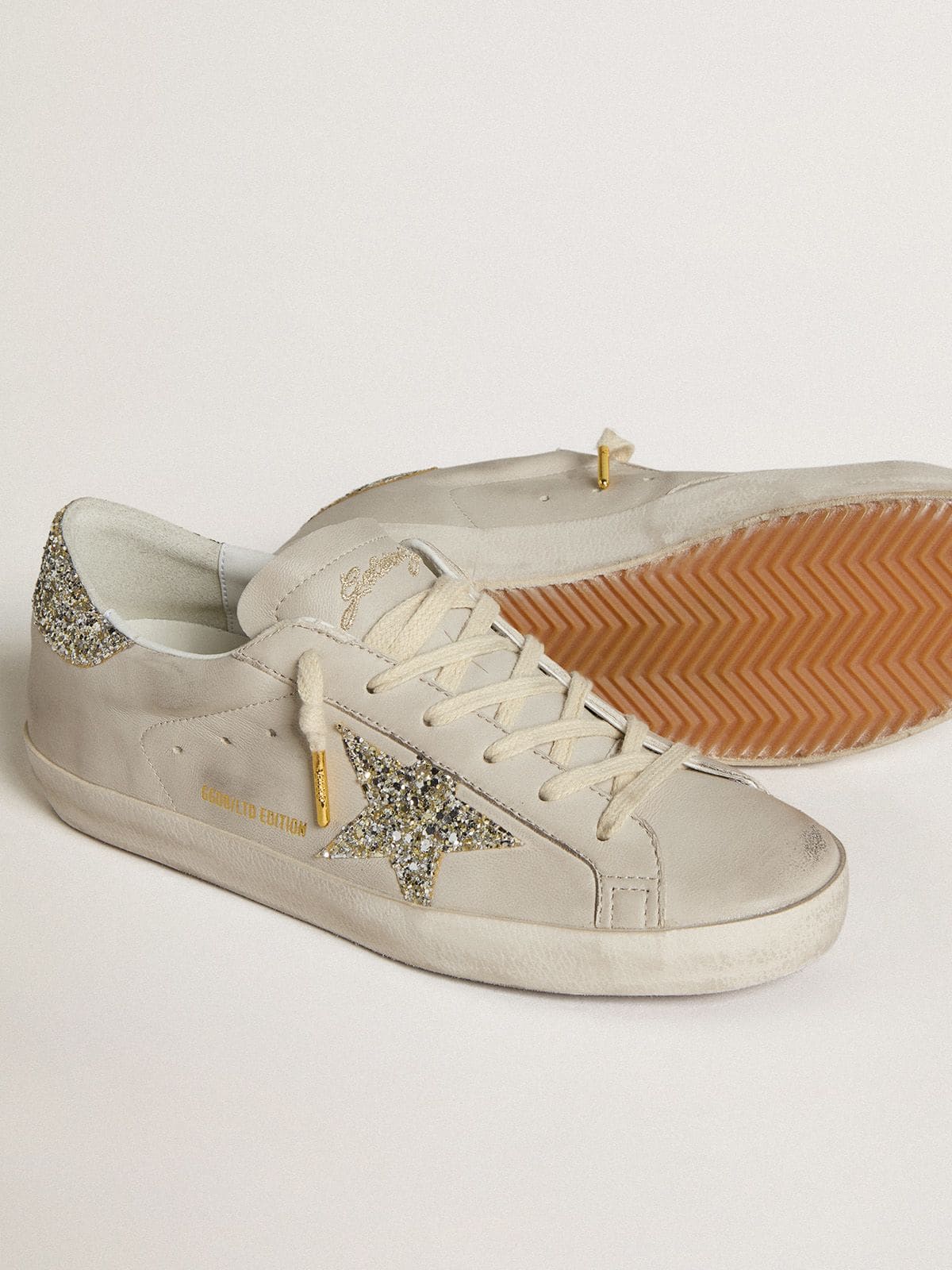 Golden Goose Women's Super-Star  in ivory nappa leather with platinum glitter star and heel tab