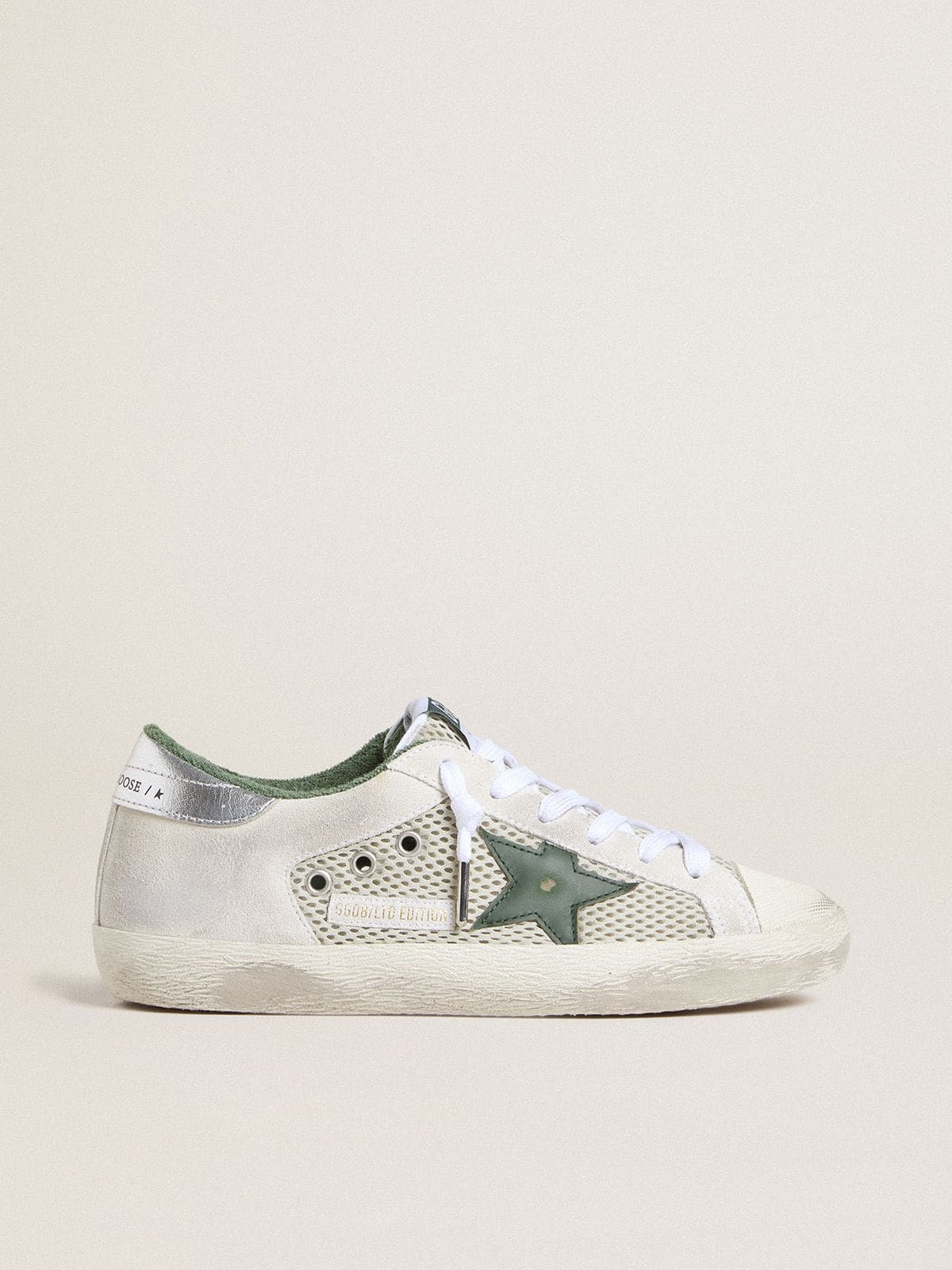 Golden Goose Women’s Super-Star LTD in white suede and mesh with green leather star and silver foiled leather heel tab