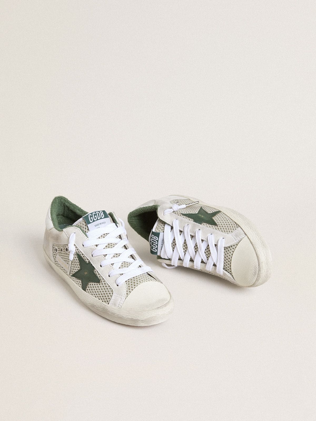 Golden Goose Women’s Super-Star LTD in white suede and mesh with green leather star and silver foiled leather heel tab