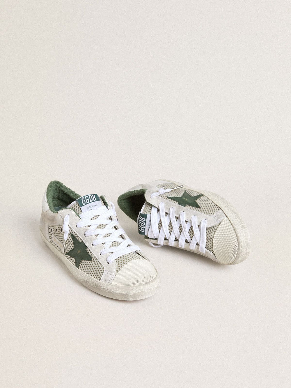 Golden Goose Women’s Super-Star LTD in white suede and mesh with green leather star and silver foiled leather heel tab