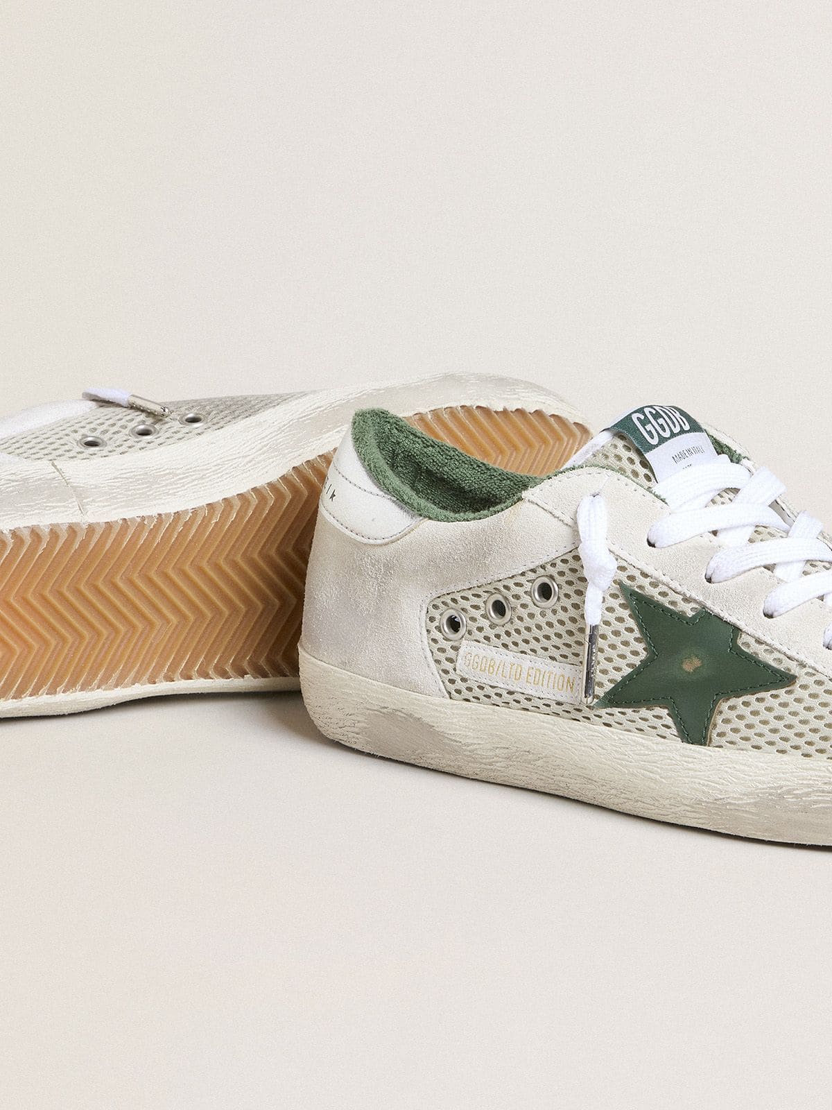 Golden Goose Women’s Super-Star LTD in white suede and mesh with green leather star and silver foiled leather heel tab