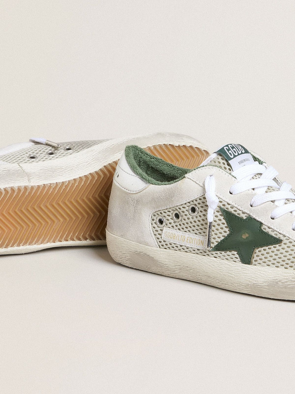 Golden Goose Women’s Super-Star LTD in white suede and mesh with green leather star and silver foiled leather heel tab