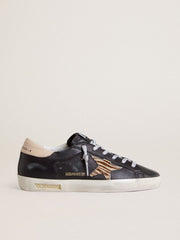 Golden Goose Women’s Super-Star in black nappa leather with zebra-print pony skin star and beige leather heel tab