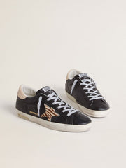 Golden Goose Women’s Super-Star in black nappa leather with zebra-print pony skin star and beige leather heel tab