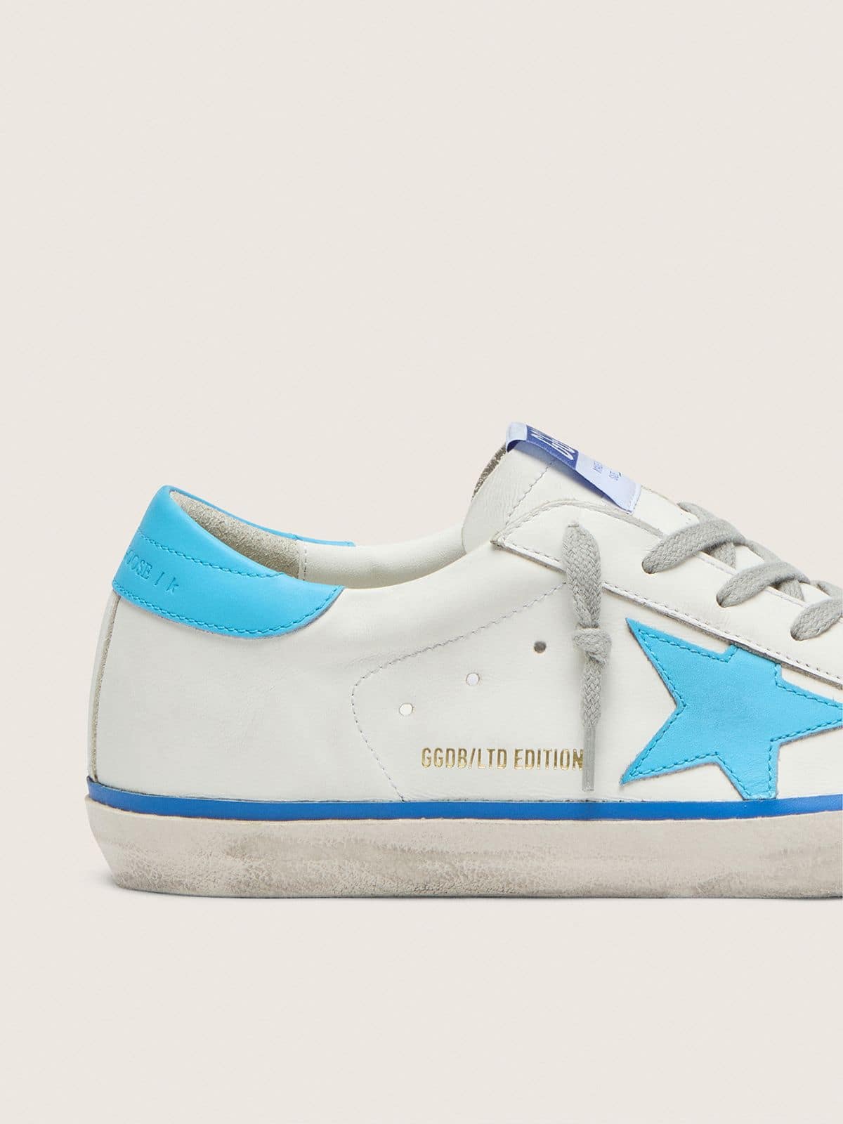 Golden Goose Women's Super-Star LTD in white leather with light blue leather star and heel tab