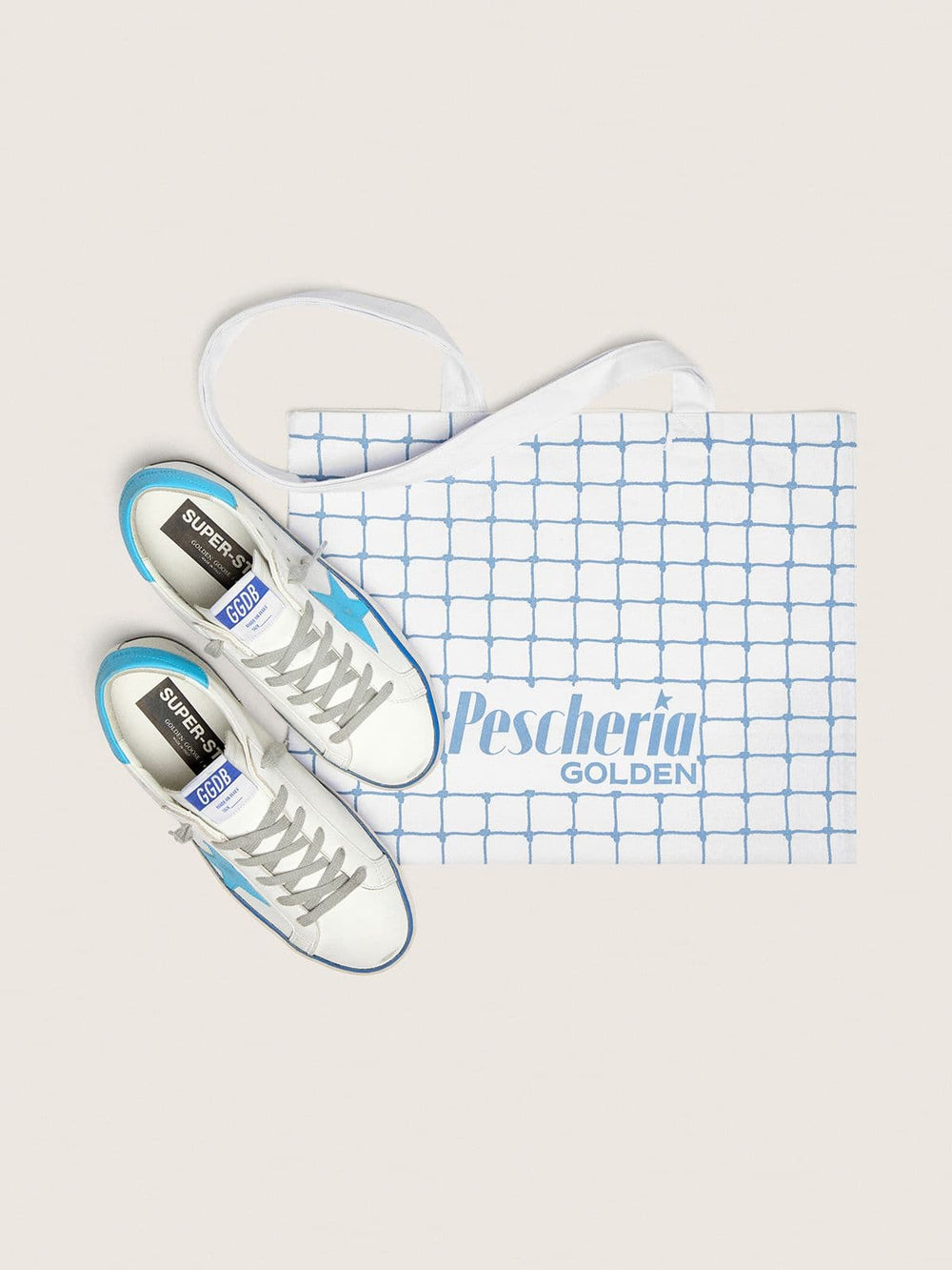 Golden Goose Women's Super-Star LTD in white leather with light blue leather star and heel tab