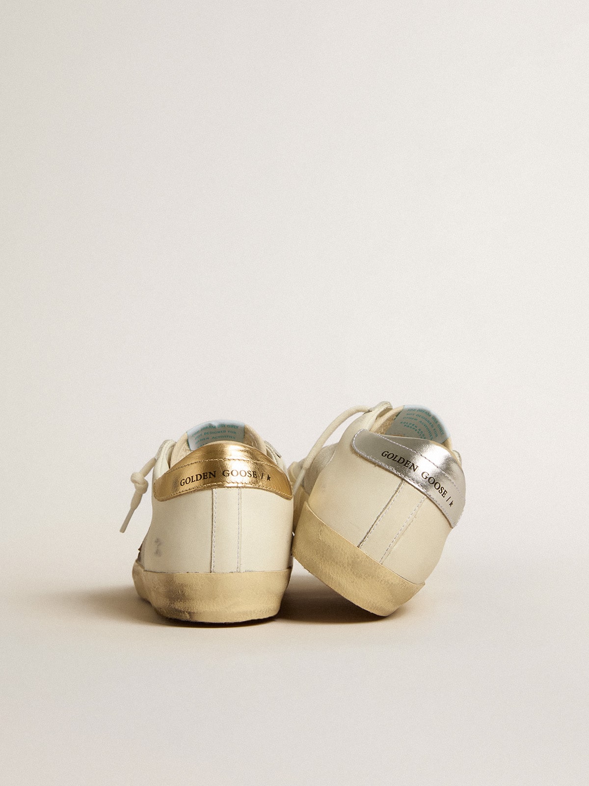 Golden Goose Super-Star in white leather and suede with silver and gold leather star