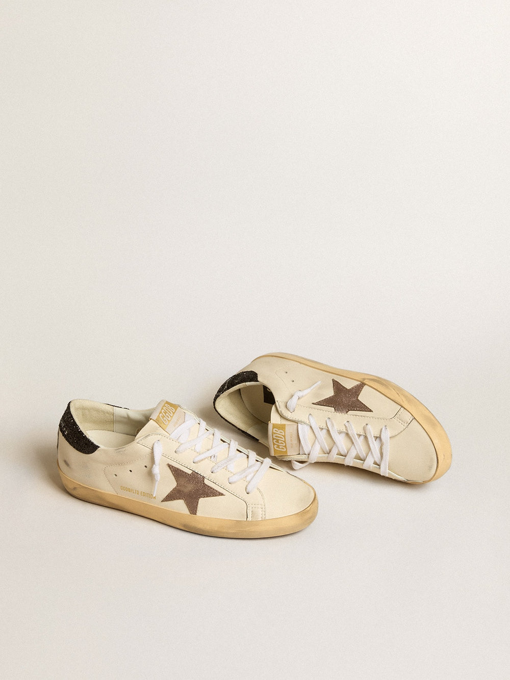 Golden Goose Super-Star LTD with laminated leather star and black glitter heel tab