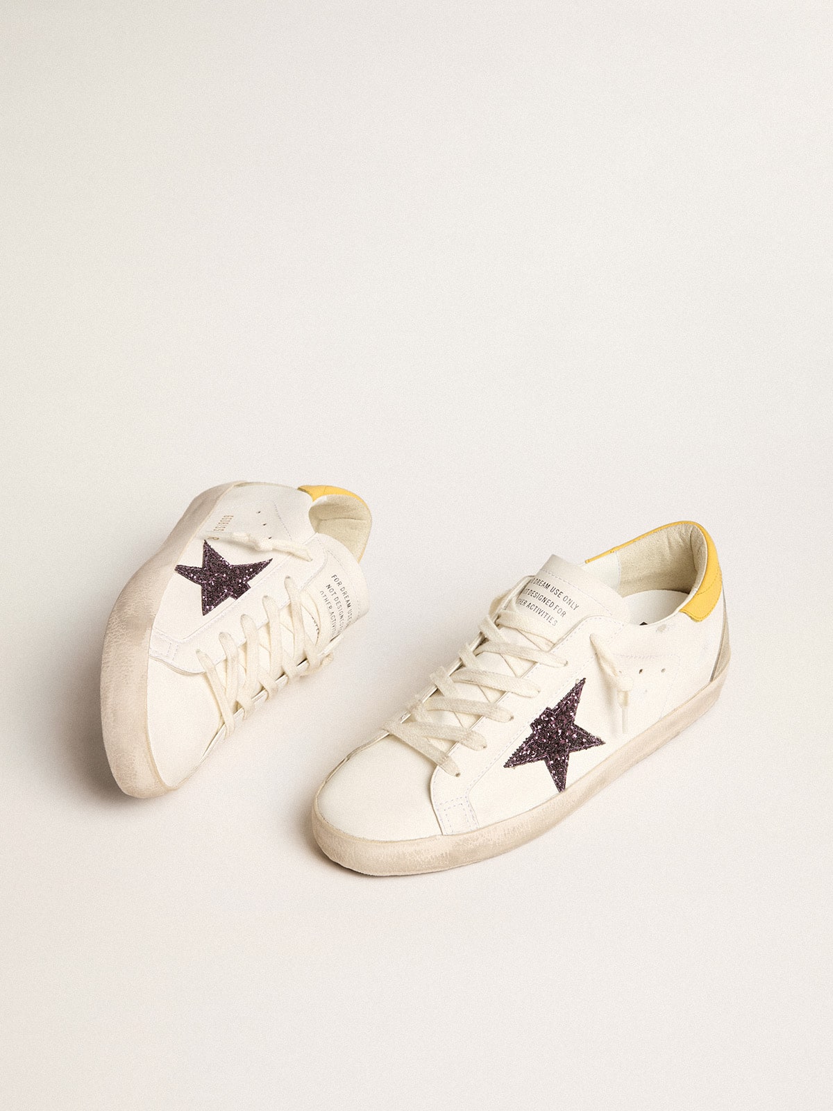 Golden Goose Women’s Bio-based Super-Star with red glitter star and leather heel tab