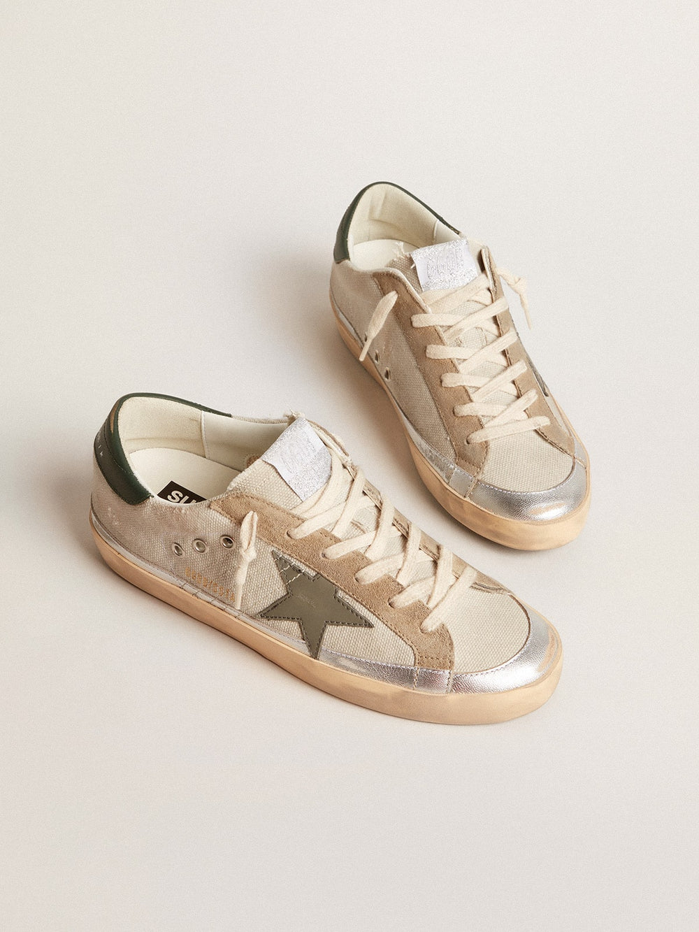 Golden Goose Super-Star in gray canvas with a green leather star and heel tab