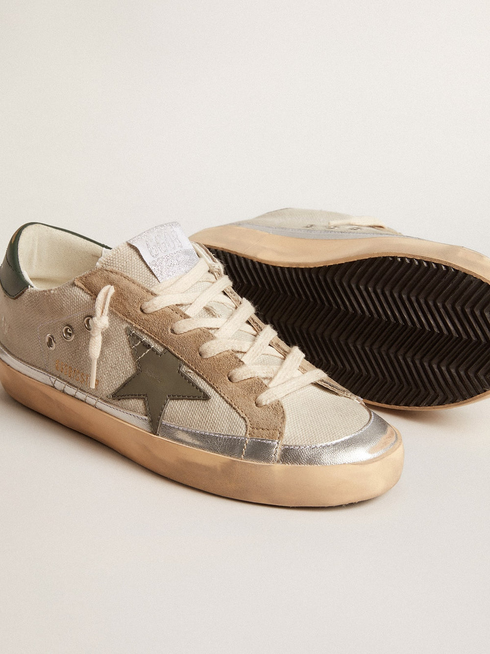 Golden Goose Super-Star in gray canvas with a green leather star and heel tab