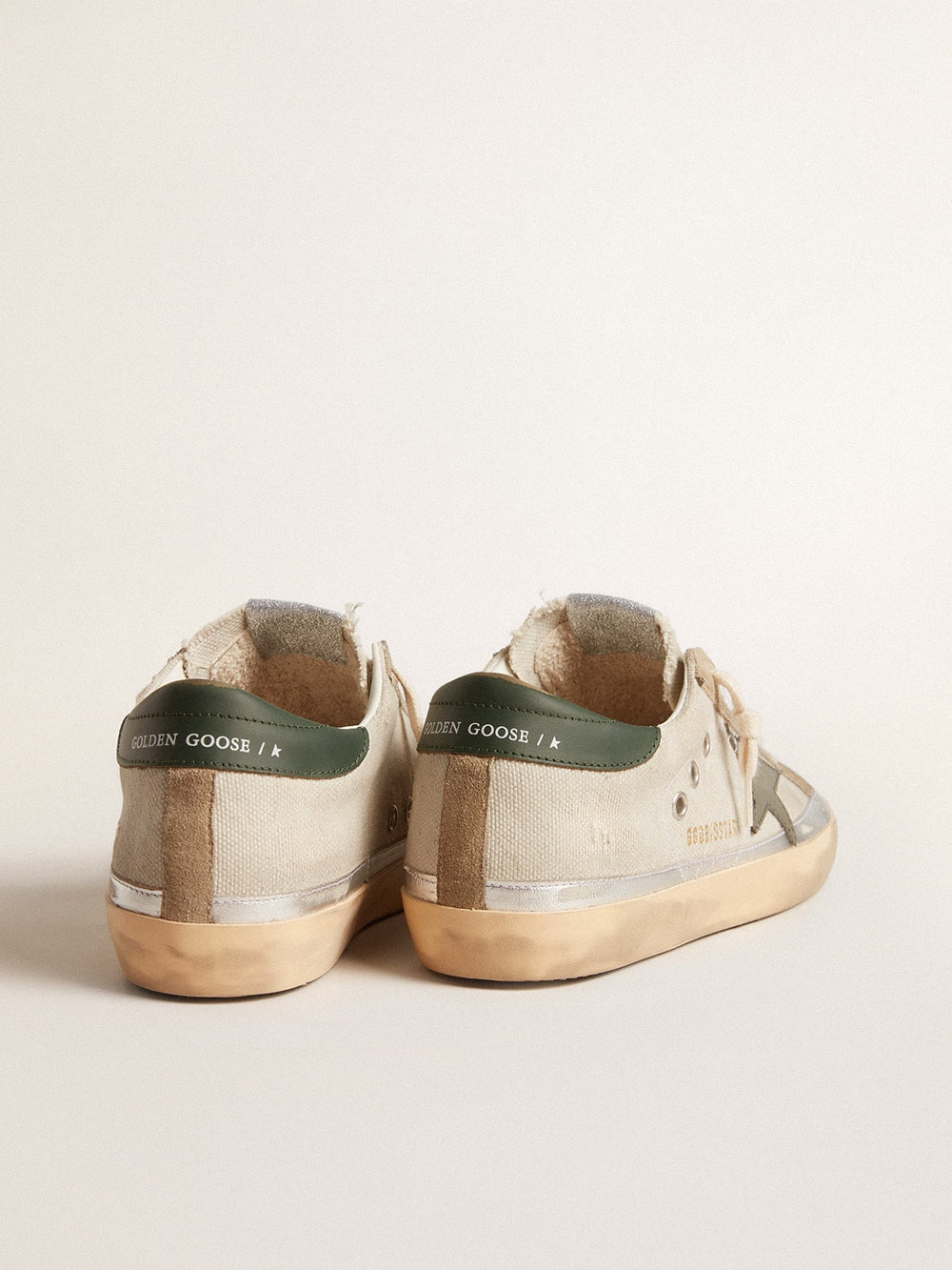 Golden Goose Super-Star in gray canvas with a green leather star and heel tab