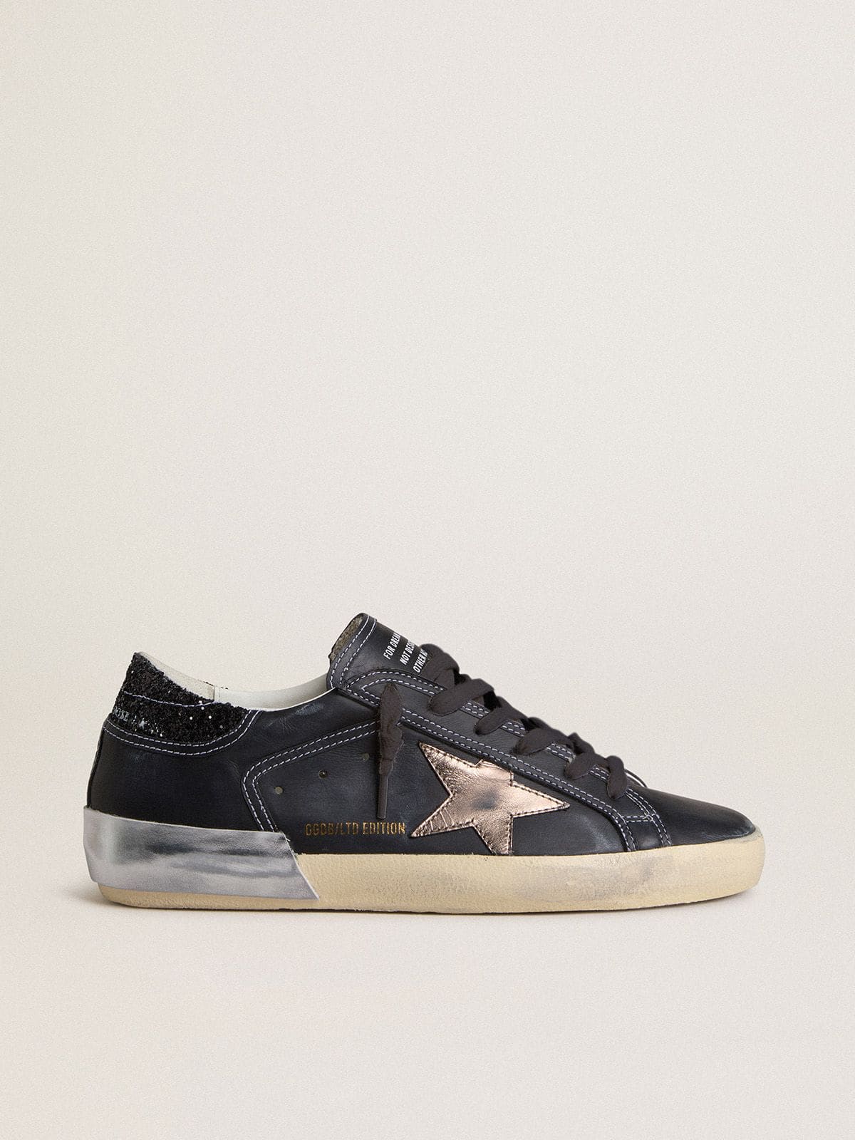 Golden Goose Women's Super-Star LTD in black leather with gold leather star and black glitter heel tab
