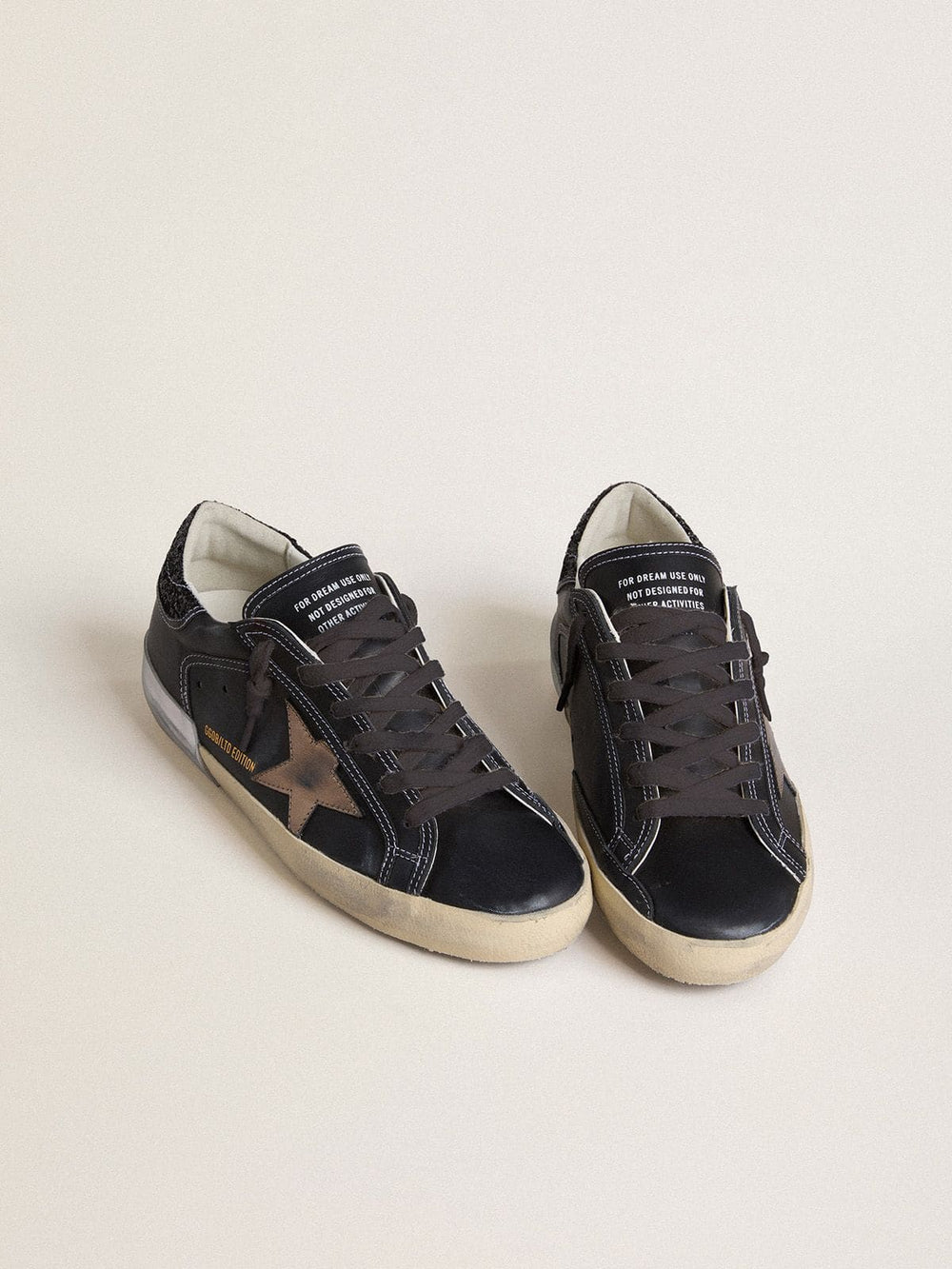 Golden Goose Women's Super-Star LTD in black leather with gold leather star and black glitter heel tab