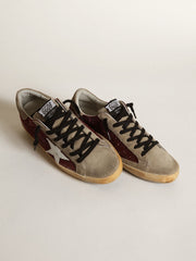 Golden Goose Women's Super-Star in burgundy glitter with white leather star and dove-gray suede tongue